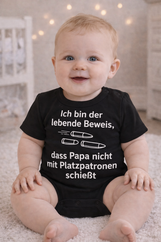 Babybody „Ich bin der lebende Beweis, dass Papa nicht mit Platzpatronen schießt” – Süßer Strampler aus 100% Baumwolle